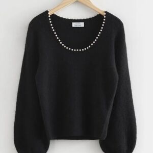 Elegant Black Sweater with Pearl Accents